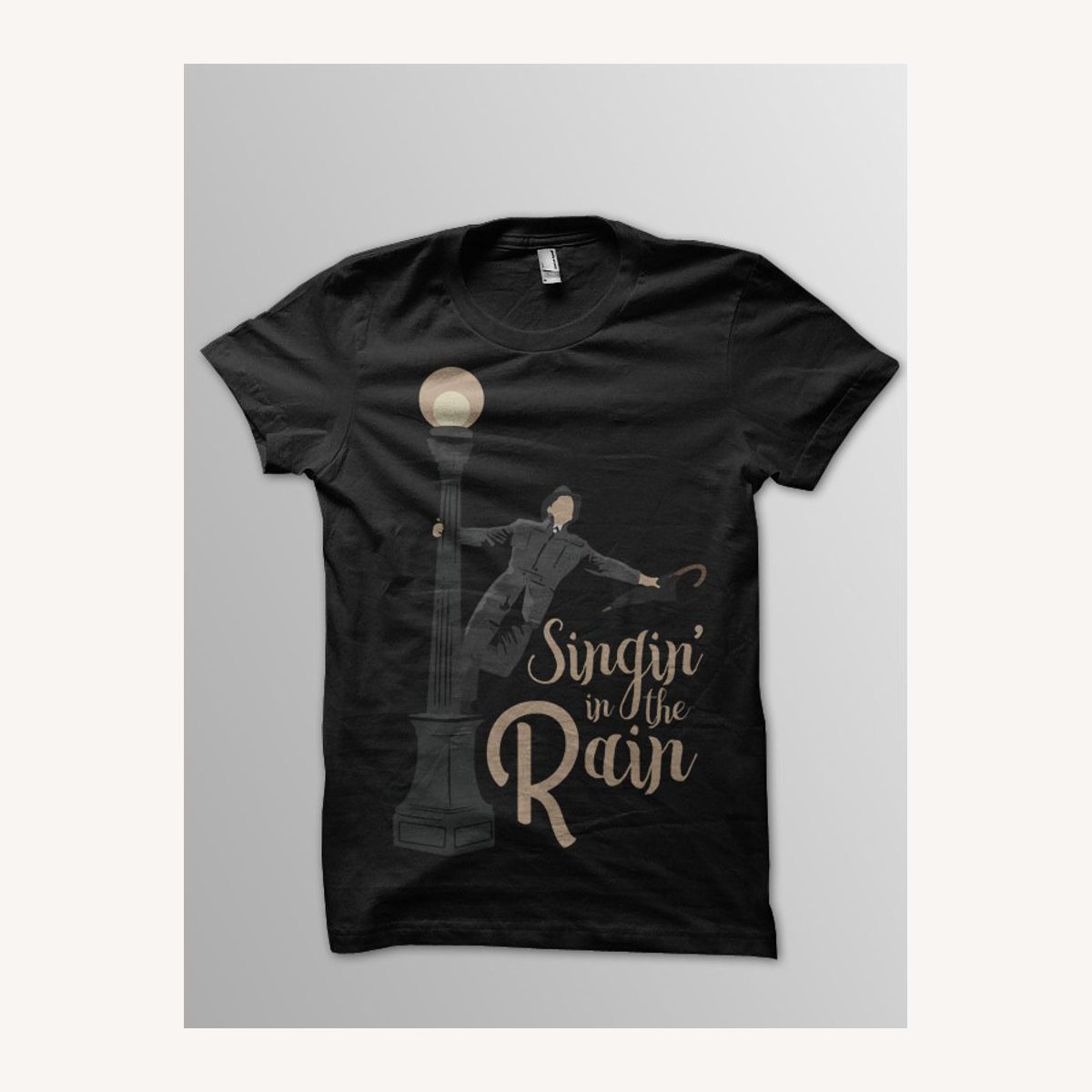 Singin in the Rain shirt design in gold on a black tee